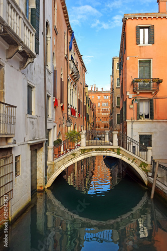 romantic cityscape of old Venice with a bridge over the canal, Italy © irisphoto1