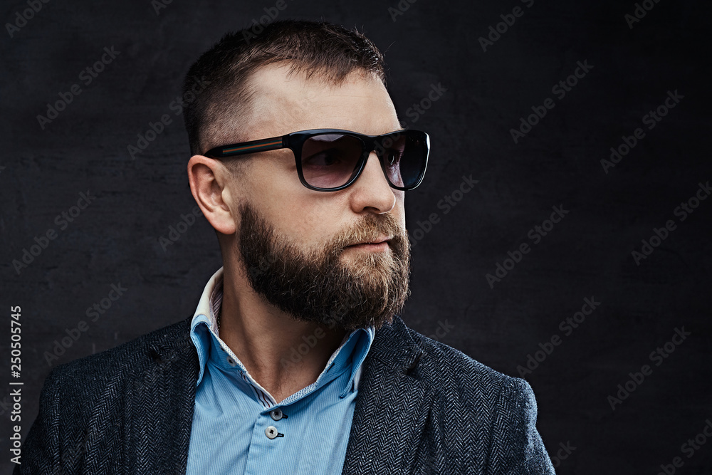 Fototapeta premium Close-up portrait of a stylish old-fashioned man wearing a beret and jacket
