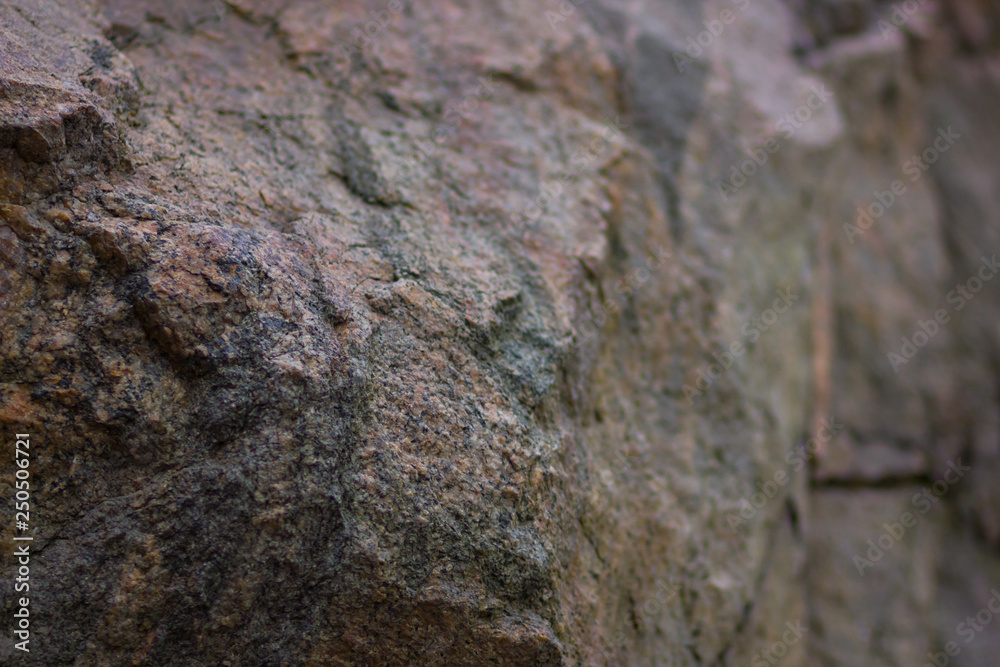 Granite rocks with blurred background. Granite close up. Texture of the stone. Natural material background