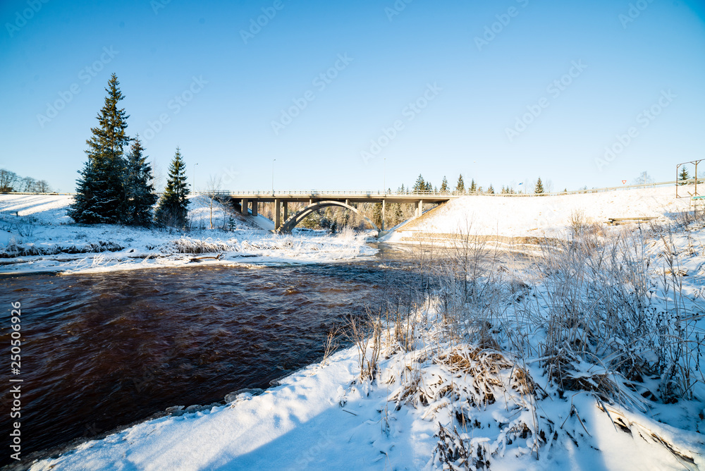 frozen forest river in winter frozen forest river in winter