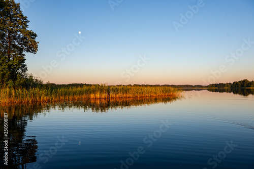 calm weather sunset on country lake