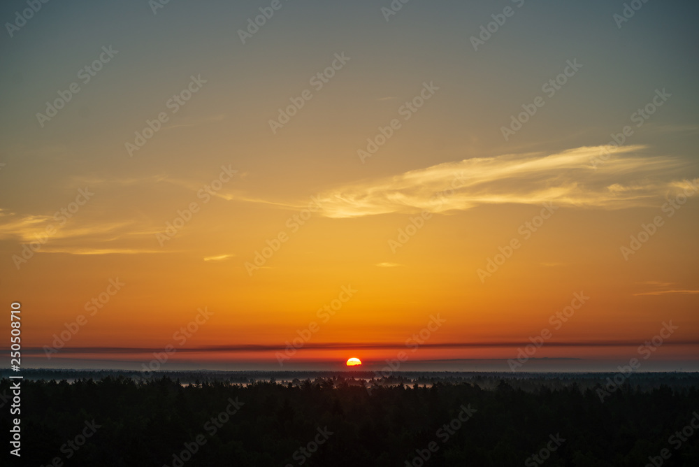 Fototapeta premium colorful sunrise sunset in misty summer meadow