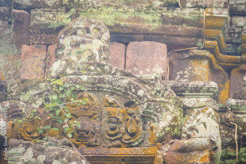 Beautiful sandstone craved on the lintel, doorway and windows of Lord Krishna killing Lion in Bapuan Khmer art at Phra That Narai Cheng Weng, Sakon Nakhon, Thailand. photo