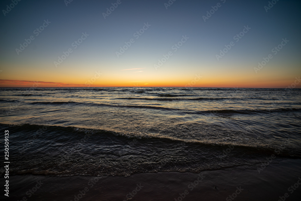 colorful sunset on the sea beach in summer
