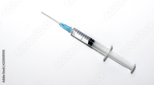 Syringe with injection on white background
