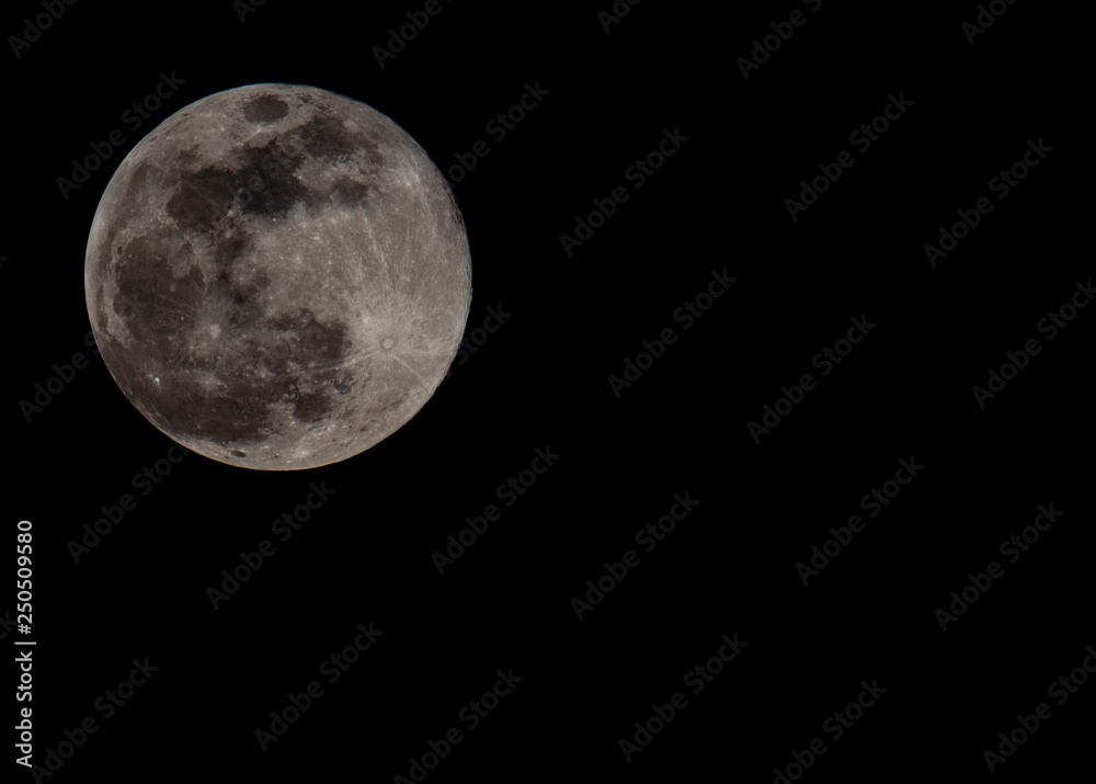 Full moon captured during Moon of Snow in February 2019 in close up. Celestial planet with visible big craters Full moon captured during Moon of Snow in February 2019 in close up. Celestial planet with visible big craters