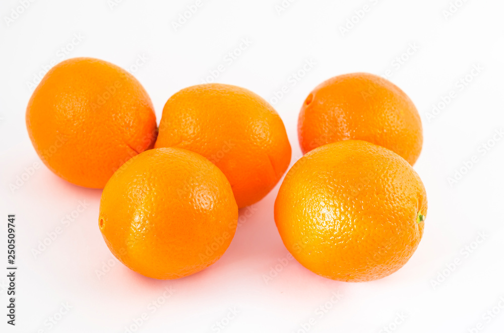 Oranges on a white background, juicy orange fruits. Useful tropical citrus fruits for a healthy diet. Oranges on a white background, juicy orange fruits. Useful tropical citrus fruits for a healthy diet.