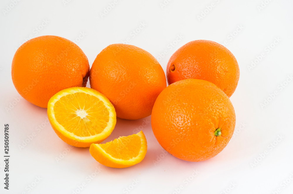Oranges on a white background, juicy orange fruits. Useful tropical citrus fruits for a healthy diet. Oranges on a white background, juicy orange fruits. Useful tropical citrus fruits for a healthy diet.