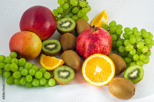 Tropical fruits on a white background  juicy still-life from fruit. Useful fruit for a healthy diet. Mix of different fruits.