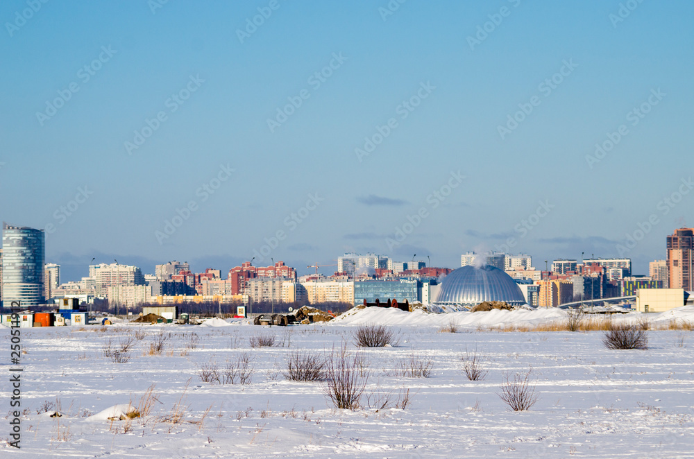 Fototapeta premium City panorama of winter St. Petersburg, a new modern district of the city, Russia, St. Petersburg, March 9, 2018