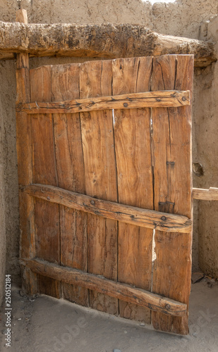 Rustic gate made of untreated wood with characteristic grain