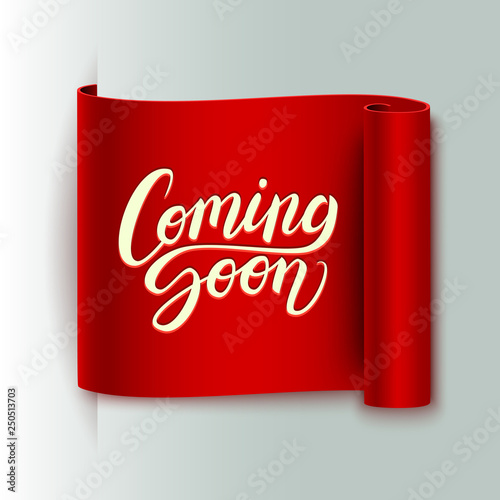 Coming soon calligraphic lettering text composition on realistic curled red ribbon, vector illustration