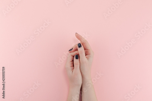 Woman's hands with black manicure