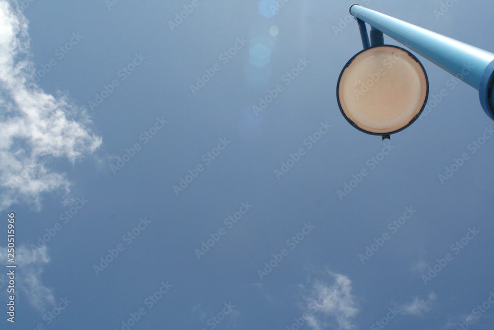 Lamppost against blue sky