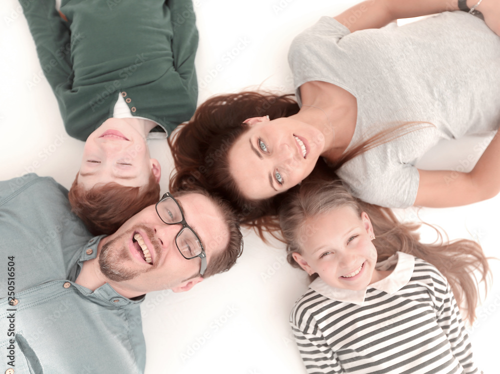 top view. happy family lying on the floor top view. happy family lying on the floor