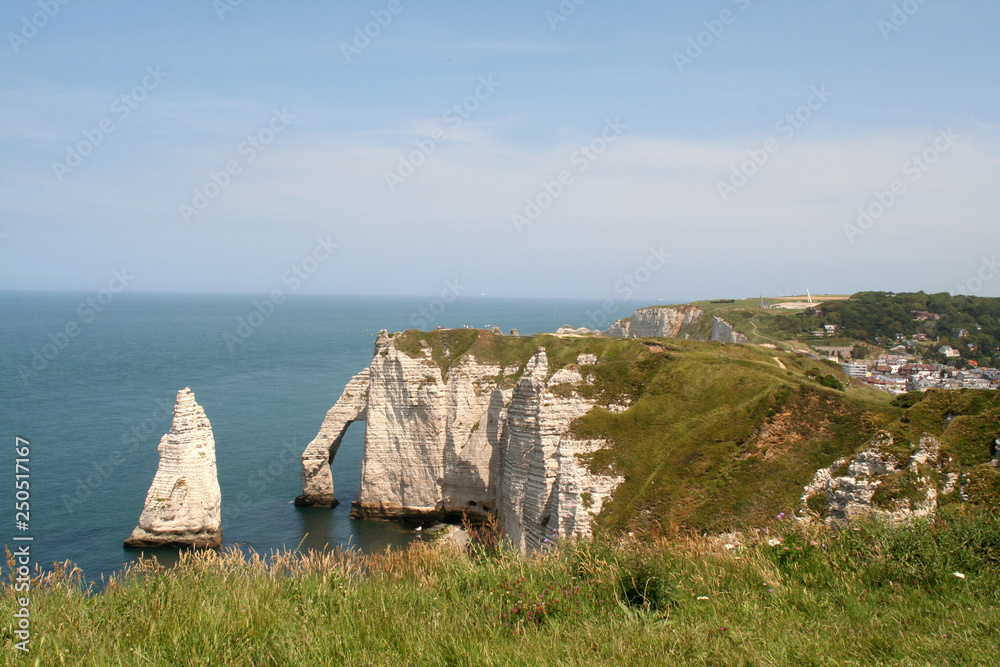 High,chalk cliffs of The France village of Etretat