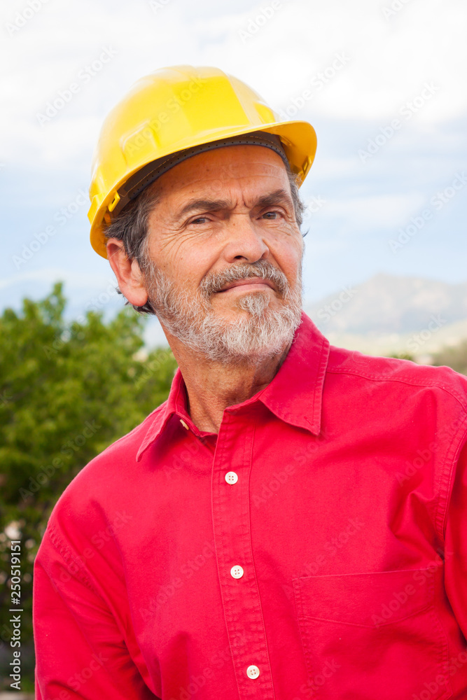 Architect, Contractor with Yellow Hardhat outdoor portrait Architect, Contractor with Yellow Hardhat outdoor portrait