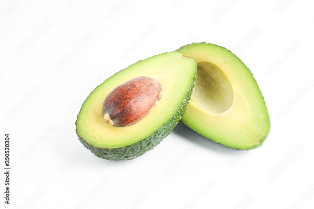 Ripe cut avocado on white background, space for text