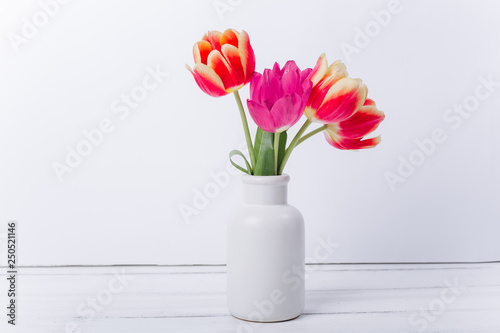 Fototapeta Naklejka Na Ścianę i Meble -  Mother's day composition.Vase with tulips and gifts