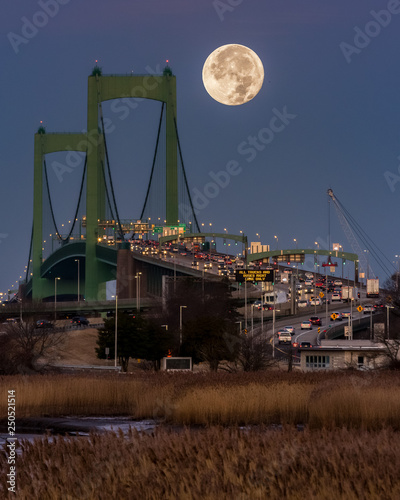 Full moon setting behind Walt Whitman Bridge in Philly 