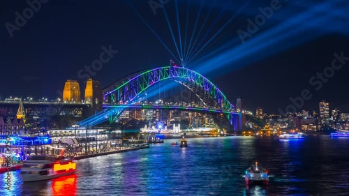 Sydney Harbour Bridge during Vivid Sydney Festival - time lapse video with zoom effect of the Spectacular light show and reflection around the Sydney Harbour Bridge and CBD of Sydney photo