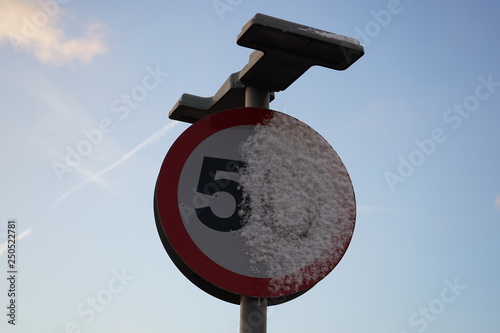 snow on speed sign