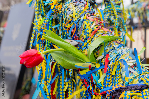 Ribbons and flowers at the memorial to the fallen heroes of euromaidan on the anniversary of the events. Kiev, Ukraine photo