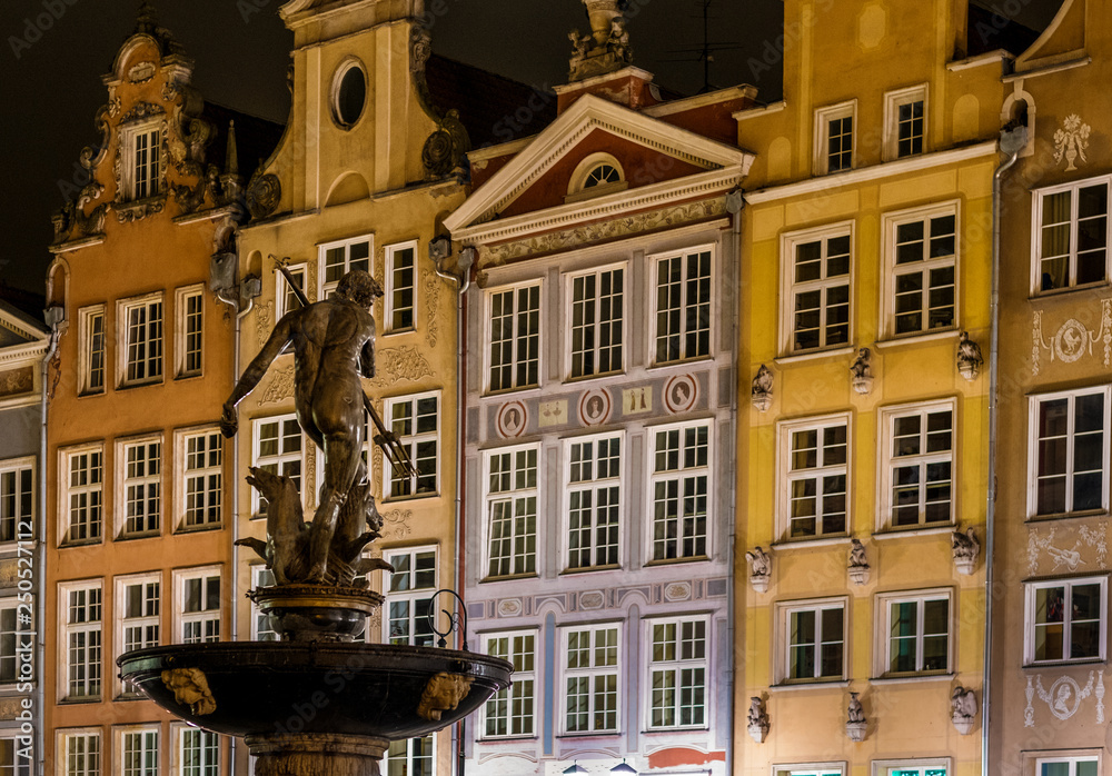 Gdansk, old town and famous crane at amaizing night with fountain in the front of view. Poland