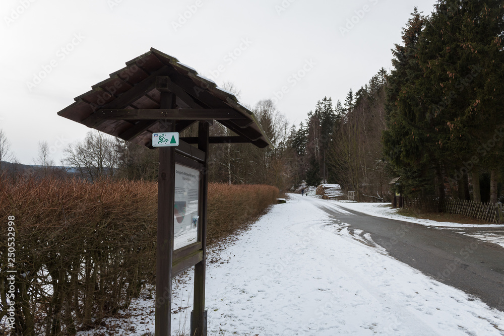 forest map kiosk directions to entrance to the forest path snow