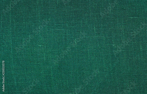 Green linen fabric texture background.