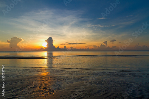 Sunrise silhouette at beach Ban Krut Beach