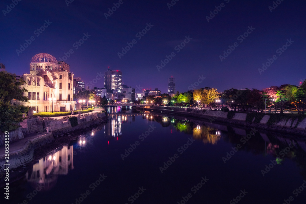 Hiroshima Cityscape by night with the Atomic Bomb Dome on the side of Motoyasu River in Japan.