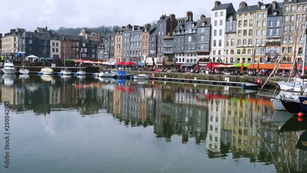 HONFLEUR, FRANCE - APRIL 08, 2018: Honfleur harbour in a beautiful day, Normandy, France HONFLEUR, FRANCE - APRIL 08, 2018: Honfleur harbour in a beautiful day, Normandy, France