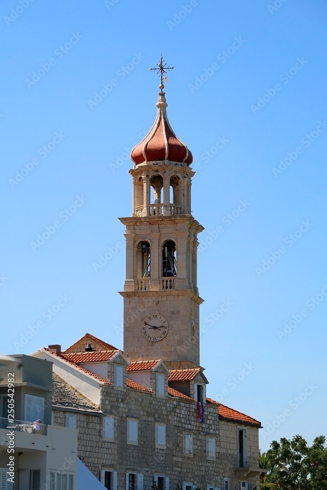 Historical bell tower in small town Sutivan, island Brac, Croatia.