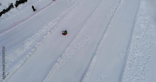 Aerial view: Tubing one of the most popular types of winter recreation. 4k