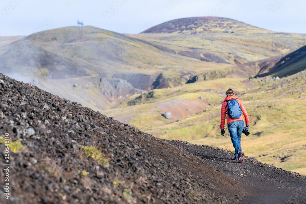 Reykjadalur, Iceland Hveragerdi Hot Springs road footpath with steam during autumn landscape morning in golden circle with people walking on hiking trail