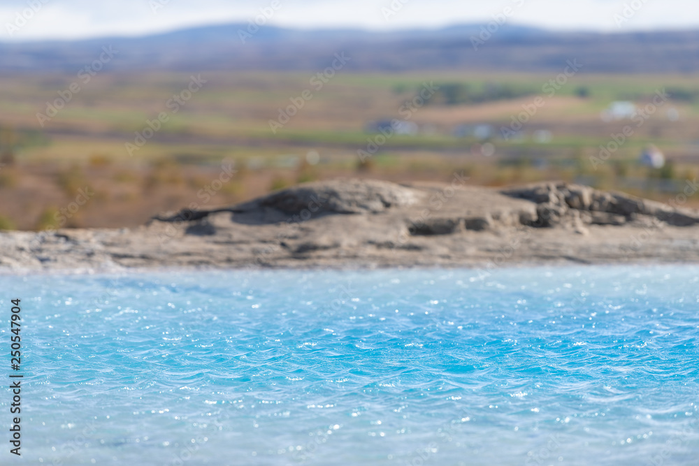 Fototapeta premium Haukadalur Valley, Iceland with abstract closeup of azure blue Great Geysir Geyser pool landscape with nobody in south Hot Springs geothermal Golden Circle