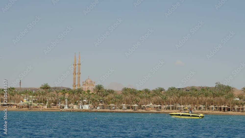 Hilly seashore with a lot of greenery and a mosque in Sharm-El-Sheikh in Egypt Hilly seashore with a lot of greenery and a mosque in Sharm-El-Sheikh in Egypt