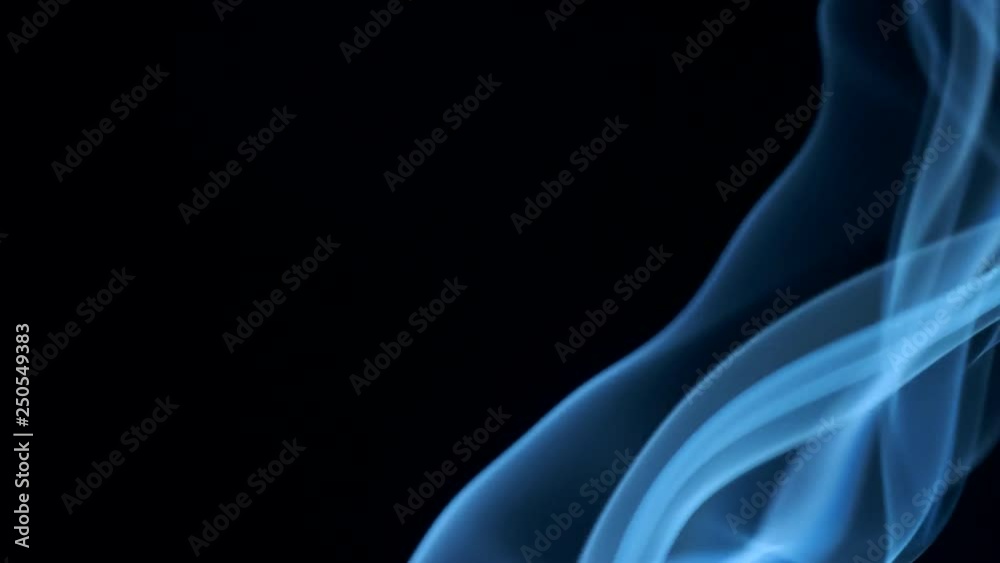 Trickle of smoke slowly rising, graceful twists on black background blowing from bottom to top. Closeup, ProRes, 50 fps Trickle of smoke slowly rising, graceful twists on black background blowing from bottom to top. Closeup, ProRes, 50 fps