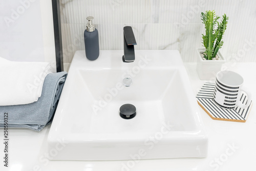 Bathroom interior with sink and faucet.