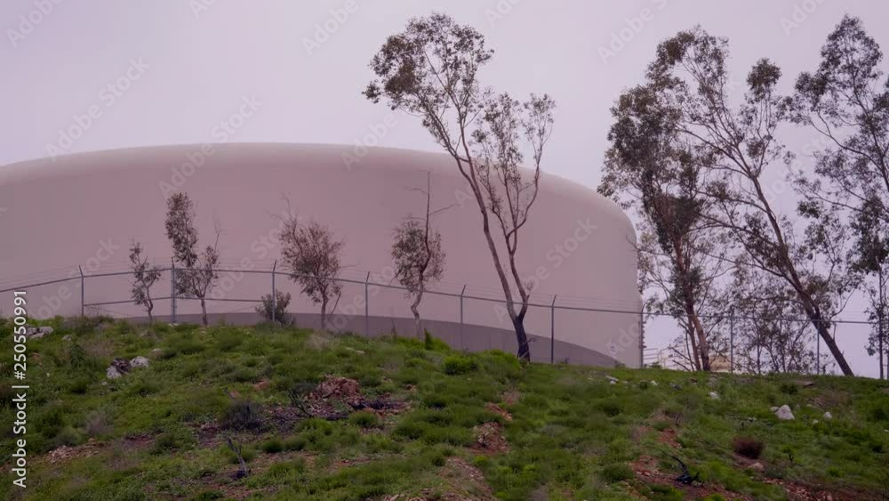 GIANT INDUSTRIAL STORAGE TANK ESTABLISHING SHOT. IN 4K, 10 BIT GIANT INDUSTRIAL STORAGE TANK ESTABLISHING SHOT. IN 4K, 10 BIT