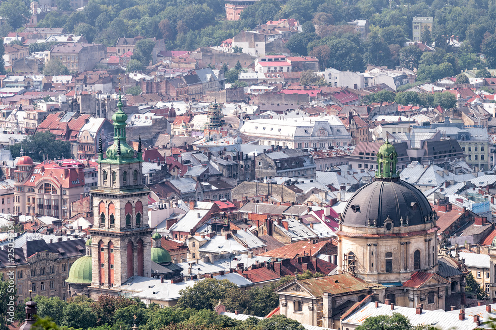 Lviv, Ukraine aerial cityscape skyline in historic Ukrainian city in old town buildings church dome architecture during sunny summer day from High Castle Hill park