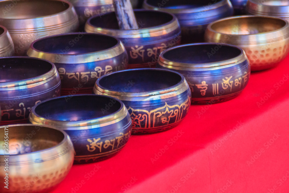 Tibetan singing bowls for sale at the antique market. Singing bowls also known as rin gongs