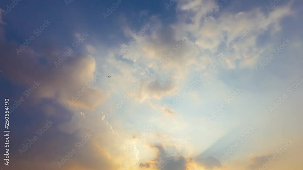 Time lapse sunbeam shine through the cloud on the blue sky . Sun rays Time lapse sunbeam shine through the cloud on the blue sky . Sun rays