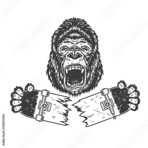 Angry gorilla holding broken skateboard