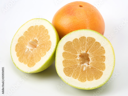 Cut citrus grapefruit fruit on white background