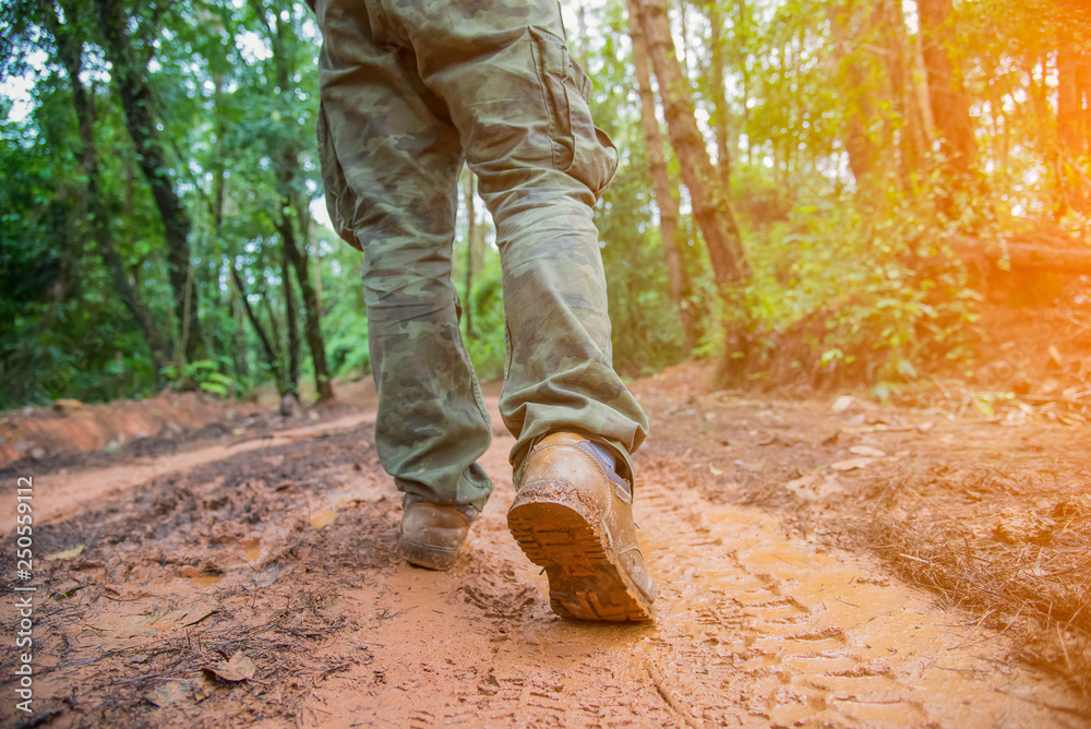 foot of young Man Traveler with backpack relaxing outdoor with rocky mountains on background Summer vacations and Lifestyle hiking concept. foot of young Man Traveler with backpack relaxing outdoor with rocky mountains on background Summer vacations and Lifestyle hiking concept.