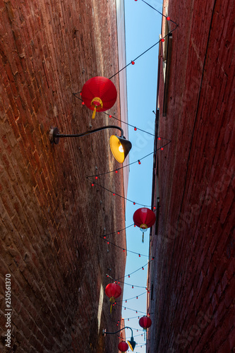 Red chinese lanterns hang in Fan Tan Alley in Chinatown, Victoria, British Columbia, Canada