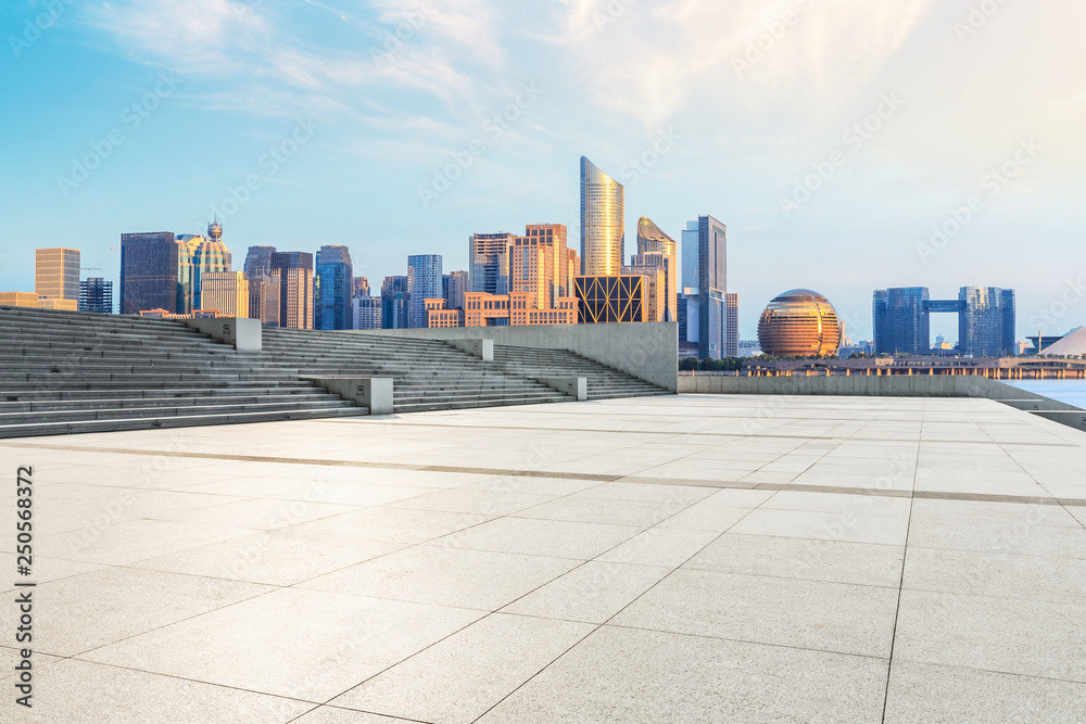 Hangzhou city skyline and empty square floor at sunrise Hangzhou city skyline and empty square floor at sunrise