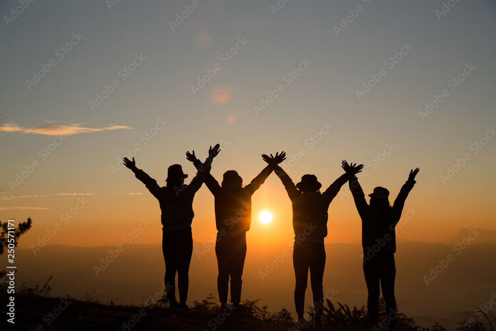Group of friends standing together on greensward and enjoying themselves. Young women enjoying on their holiday outdoors. Group of friends standing together on greensward and enjoying themselves. Young women enjoying on their holiday outdoors.